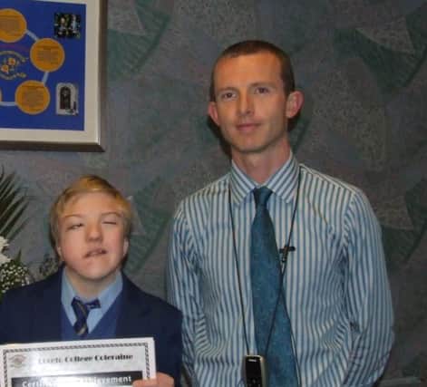 Loreto College Year 10 student Corey Cassidy, who received the Gold Merit Award, with his Head of Year Mr K Conroy.