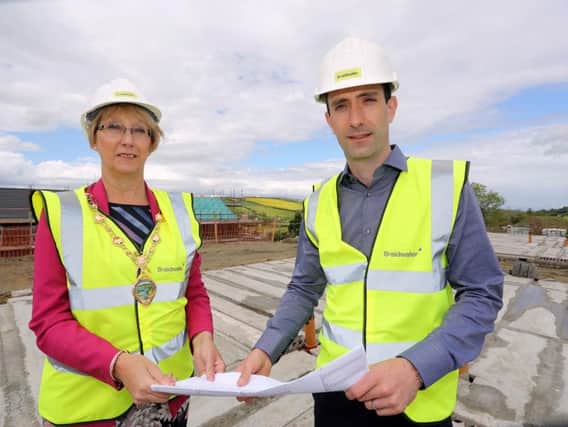 Mayor of Derry City and Strabane District Council, Alderman Hilary McClintock, and Joe McGinnis, Managing Director of Braidwater, pictured on site at Ashbrook Court in Drumahoe, Londonderry.