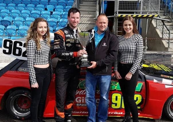 John Christie (second left) collects his Irish Open Championship prize thanks to a successful weekend as part of the 40th anniversary celebrations for Ballymena Raceway,