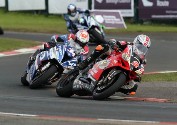 Glenn Irwin on his way to victory over Alastair Seeley in the feature NW200 Superbike race.