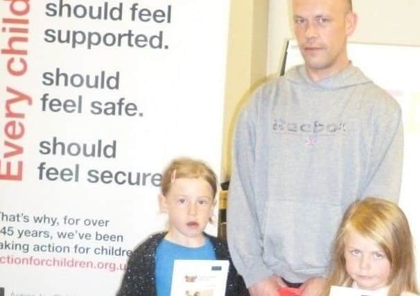 Steven Workman and his children Ellie and Amber Workman attend the launch night of FRED at Action for Childrens Larne parental support project.