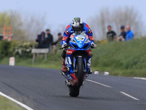 Michael Dunlop on the Bennetts Suzuki at the North West 200.