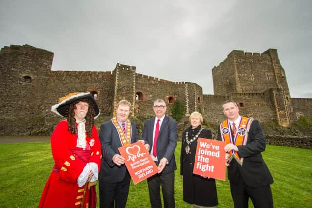 The British Heart Foundation has been announced as the charity partner of the Royal Landing in Carrickfergus. Pictured are (from left) King William; Deputy Grand Master of the Grand Orange Lodge of Ireland, Harold Henning; BHF NI fundraising manager, Gary Wilson; Mayor of Mid and East Antrim Borough Council, Audrey Wales; and chairman of the Carrickfergus Historical Re-enactment Group, Darren McAllister. INCT 21-753-CON