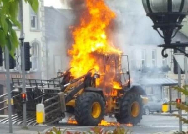 The dramatic scene in Banbridge town centre when a farm loader burst into flames on Wednesday afternoon. Pic by Nadine Scullion