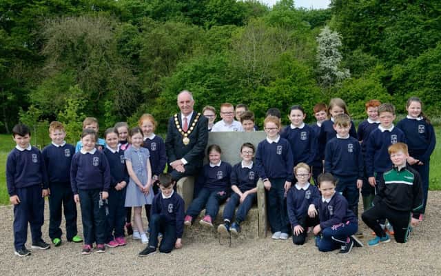 Chair of Mid Ulster District Council, Councillor Trevor Wilson joins Sacred Heart Primary School, Rock, Dungannon for a Living History session at Tullaghoge Fort.