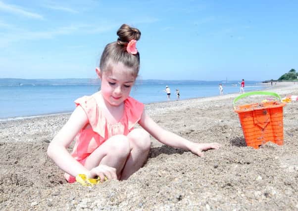 People take advantage of the good weather and take to the beach at Seapark in Co Down.  
Lexi Dempster(7) from Castlereagh enjoys the beach. 

Picture by Jonathan Porter/PressEye.com