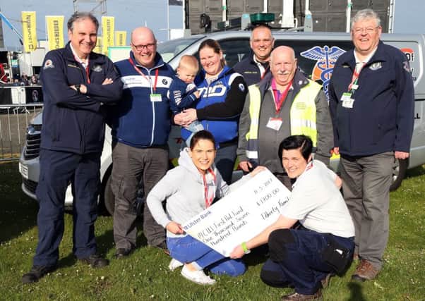 The Doherty family presented a cheque to the MCUI Medical Team at the North West 200 on behalf of their late mother.