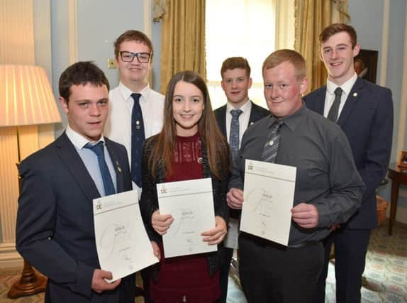 Young people from Larne receive their Gold Duke of Edinburgh awads.  
Photo by Aaron McCracken Photography