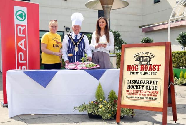 Pictured with the Mayor, Councillor Brian Bloomfield MBE to promote the upcoming Hog Roast fundraiser for the Mayor's Charity TinyLife are: Kimberley Hill from TinyLife and Marie-Claire Caldwell, Marketing & Communications Executive for the Henderson Group.