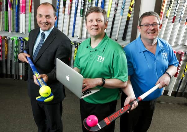 Steven McMurray (left), McMurray Sports, DJ Wilson (centre), Ulster Bank, and Alan McMurray, McMurray Sports, mark the deal, which will see the local company acquire Scottish rival, Gilmour Sports.