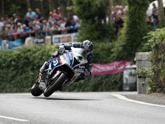 Ian Hutchinson topped the Superbike times on Tuesday evening at the Isle of Man TT on the Tyco BMW.