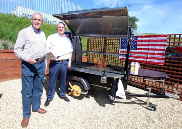 Promoting the opportunity to trade in the Atlanta market as part of the upcoming Lisburn and Castlereagh City Council Trade Development Programme to Atlanta are: Lester Manley (right), Managing Director of Trailblazer BBQ, and Councillor Uel Mackin, Chairman of the council's Development Committee.