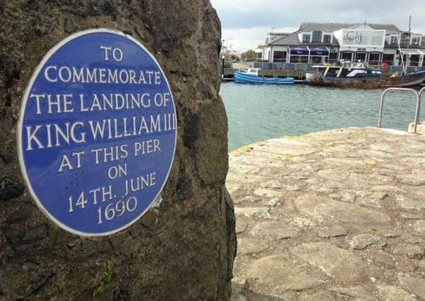 A plaque at Carrickfergus harbour marking the historic landing. INCT 23-755-CON