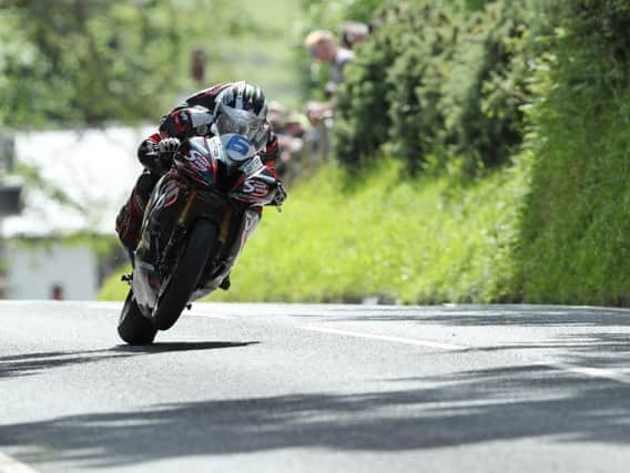 Michael Dunlop won the first Supersport race on Monday to move onto 14 wins at the Isle of Man TT.