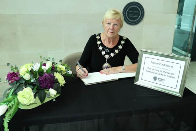 The Mayor of Mid and East Antrim Cllr Audrey Wales signing one of three books of condolence opened across the borough for victims of Saturdays London attacks. INCT 23-759-CON