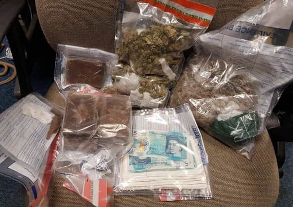 Drugs and cash seized from the property in the Lisburn area. Picture posted by PSNI Craigavon.