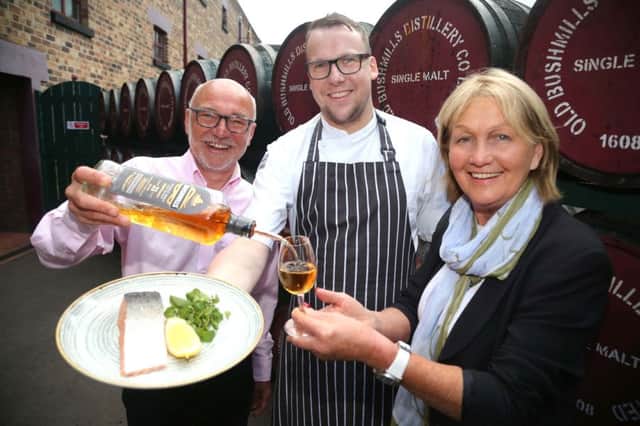 Niall Mehaffey and Chris Gibson from Bushmills Distillery pictured with celebrity chef Jenny Bristow at the launch of the Bushmills Salmon and Whiskey Festival which takes place on June 17th and 18th. Picture: Kevin McAuley/McAuley Multimedia