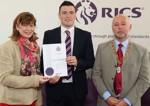 James McGennity from Craigavon, a newly qualified member of RICS (Royal Institution of Chartered Surveyors), the leading qualification when it comes to professionalism in land, property, construction, is pictured receiving his diploma from Fiona Grant, RICS UK & Ireland Chair and Andy Tough FRICS, Chair RICS Northern Ireland.
