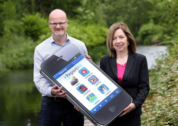Councillor Tim Mitchell, Chairman of Lisburn & Castlereagh City Council's Governance and Audit Committee, and Chief Executive, Dr Theresa Donaldson are encouraging residents to 'Report All' through the new app.