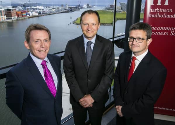 Pictured are Michael McQuillan, director of Ulster University Business School (left), Darren McDowell, Ppartner Harbinson Mulholland (right), with William Barnett of W & R Barnett, who took the number one spot for a second year in a row.