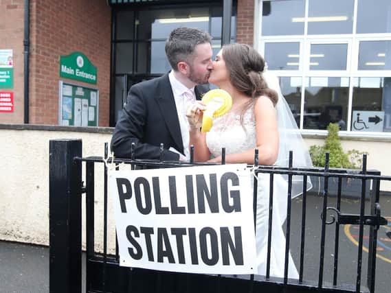 Alliance Party candidate for west Belfast Sorcha Eastwood pictured after her wedding to Dale Shirlow placing her vote at Brownlee Primary School in Lisburn