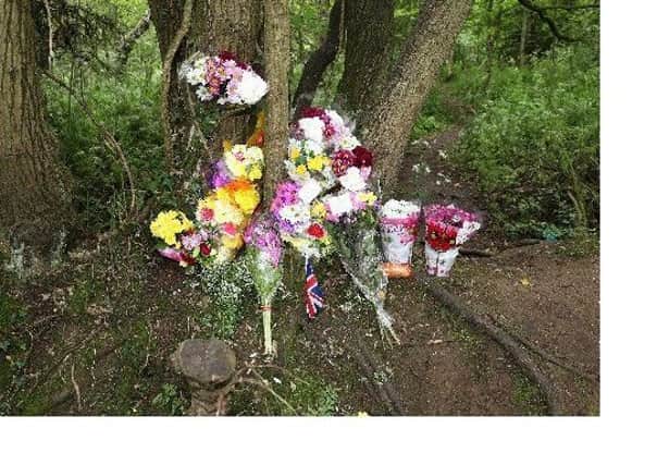 Floral tributes left for Caitlin White (Shortland) at Corcrain woodland.