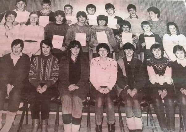 Miss Jackie Walker (extreme left middle row) youth leader at Lurgan Boys Annexe with boys and grils who obtained their Duke of Edinburgh Award in 1984