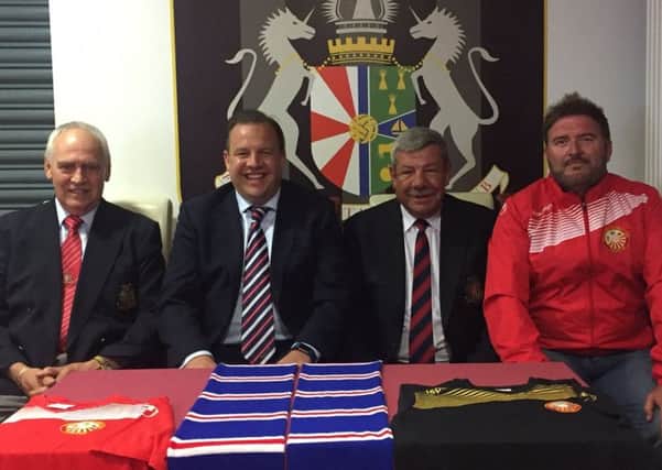 Phil Cowen (second left, Rangers community football executive) celebrates the launch of Glasgow Rangers' friendly next month against Portadown at Shamrock Park. Also included, from left, are Portadown's Bill Emerson (club secretary), Ronnie Stinson (club chairman) and Niall Currie (manager).