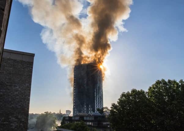 Smoke billows from a fire that has engulfed the 27-storey Grenfell Tower in west London.