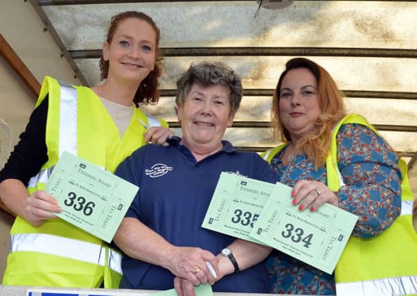 Working hard behind the scenes at the Waringstown Vintage Cavalcade are volunteers, from left, Anne Crossan, Anne Hyland and Gemma Crawford. INLM26-204.