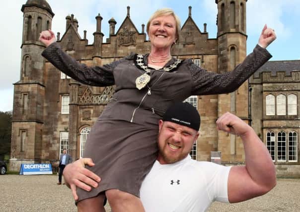 Councillor Audrey Wales, former Mid & East Antrim Mayor, pictured launching  the Dalriada Wife Carrying Competition with strong man Chris McNaughton.