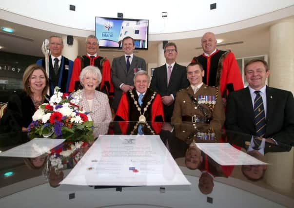 Pictured with the signed Armed Forces Covenant are: (front l-r) Dr Theresa Donaldson, Chief Executive; the Lord Lieutenant of County Antrim, Mrs Joan Christie, OBE; the Mayor, Councillor Brian Bloomfield MBE; Lt Col Karl Frankland, Commanding Officer, NI Garrison Support Unit; Mr Raymond Corbett, President, Royal British Legion (back l-r) Jack Adair MBE, Mace Bearer; Councillor Tim Morrow, Chairman of the council's Leisure & Community Development Committee; Col (Retired) Johnny Rollins MBE, Chief Executive, Reserve Forces & Cadet Association NI; the Rt Hon Sir Jeffrey Donaldson MP; and Alderman James Tinsley, the council's Armed Forces Champion.