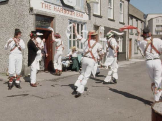 Morris dancers outside the Harbour Bar in Portrush.
