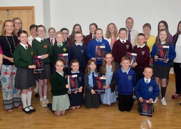 Pupils and staf from St Ronan's College and local primary schools who took part in a writing project organised by the college, called The Magical Doors. The project culminated in the launch of an e-book of the same name. INLM25-200.