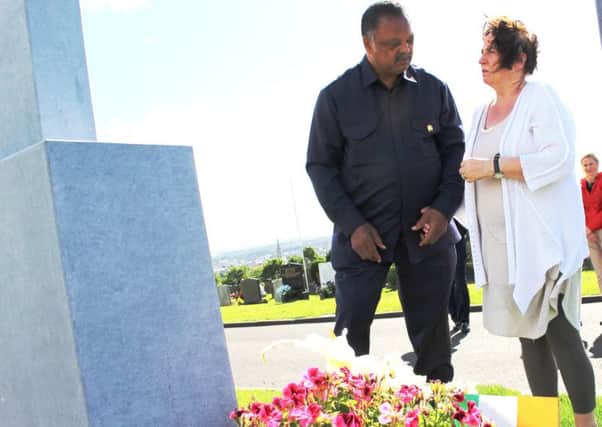 Rev Jesse Jackson pictured at Martin McGuinness' graveside with his widow, Bernie.