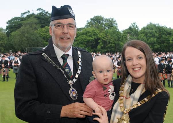 March past:    George Ussher (RSPBA President) pictured with the Lord Mayor of Belfast, Councillor Nuala McAllister (Chieftain of the Gathering) and her son Finn during the march past at the UK Pipe Band Championships at Stormont on Saturday 10th June.