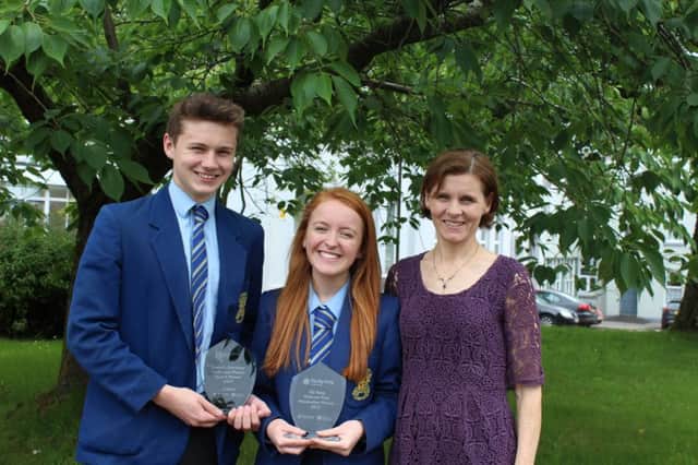 Loreto College students Donal Close and Sian Donaghy, with teacher Mrs M Close, winners of the QUB Maths and Physics prize at the NI Young Innovators Competition.