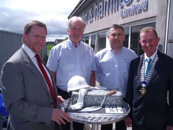 Helping cut the cake are Barry Neilson - Chief Executive at the Construction Industry Training Board (CITB), David Hamilton - Managing Director at Martin & Hamilton, Alastair Martin - Financial Director at Martin & Hamilton and David Henry - President of the Construction Employers Federation (CEF).