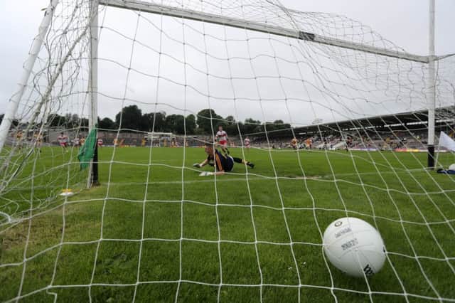 Derry full back Conor McCluskey fires a penalty to the Antrim net past Antrim keepeer Michael Byrne. (Pic by John McIlwaine - Press Eye/INPHO)