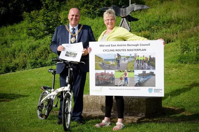 The Mayor, Councillor Paul Reid and Lynda Foy, Countryside officer Mid and East Antrim Borough, unveiling new plans for cycle routes across the borough. INCT 25-798-CON