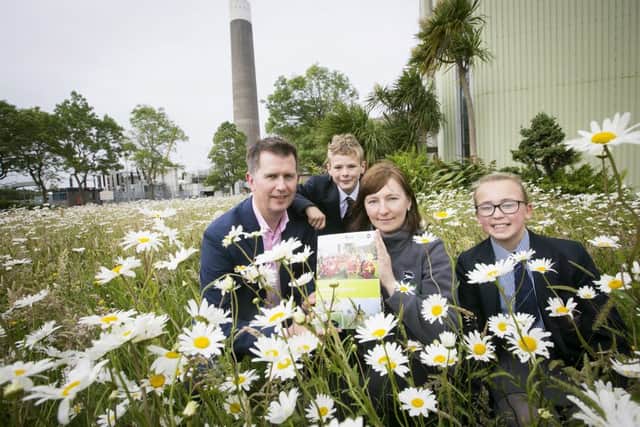 Pupils Samuel Whaley and Amy Wilkinson, from Larne Grammar School join Ian Luney, president of AES UK and Ireland and Monika Wojcieszek, from Ulster Wildlife, at the launch of the electricity generator's new Biodiversity Action Plan.