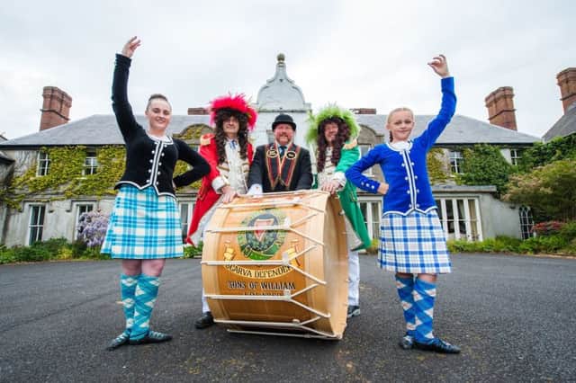This year's annual sham fight at Scarva will offer an added cultural experience for visitors. Pictured with highland dancers ahead of next month's flagship event are Sandy Heak, chairman of the Royal 13th organising committee (centre), King William (second from left) and King James. INBL scarva