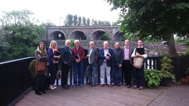 Carrickfergus Townscape Heritage Initiative project board members pictured with ARCHES directors at the landmark bridge and viaduct over the River Maine in Randalstown. INCT 26-702-CON