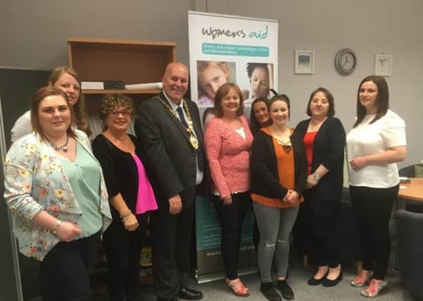 Mayor of Mid and East Antrim Councillor Paul Reid pictured with volunteers and staff from Womens Aid in Larne.