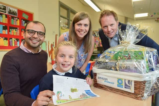 Av Raichura from Amazon, Amazon Design a Drone competition winner Hannah McFarland and her teacher Alison McKelvey from Fourtowns Primary School, Ahoghill with Henry Kilworth from the Civil Aviation Authority. Photo by Aaron McCracken UNP