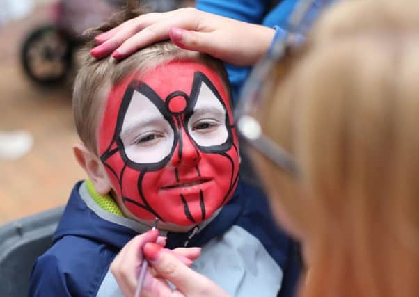 Enjoying the face painting during the Ballymena Means summer carnival.