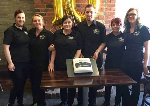Staff from The Highway Inn, Trumbles Off Sales and The Highway Kitchen - Amy Neill, Emma Robb, Amanda Moorehead, Neil Reilly (Manager), Katrina White and Chelsea Brown - celebrating the 10th anniversary of the Resurgam Trust's ownership of The Highway Inn.