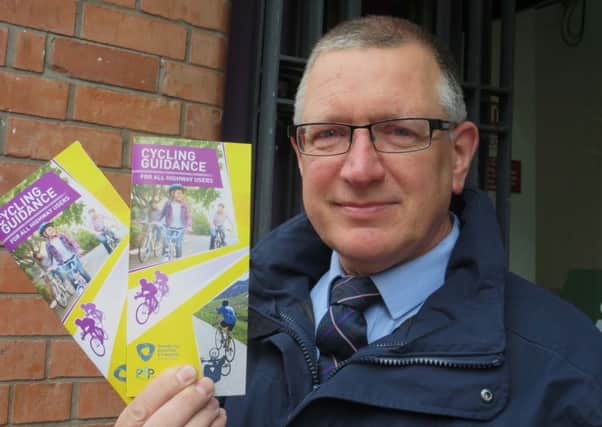 Alderman Robert Smyth with the cycle leaflets.
