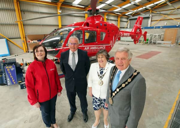 AANI Project Officer, Briege Mulholland; AANI Chairman, Ian Crowe; Mrs Rosalind Bloomfield and Councillor Brian Bloomfield MBE at the Air Ambuilance operational base at Maze Long Kesh.