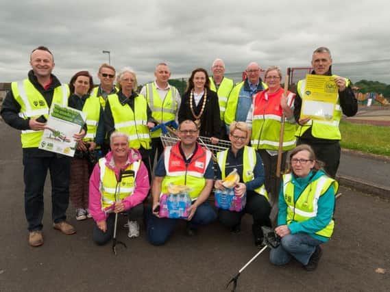 Mid and East Antrim Deputy Mayor, Cllr Cheryl Johnston with volunteers from The Hope Centre and Dunclug Partnership who took part in the cleanup, with support from Tesco who provided the refreshments. INBT 26-790-CON